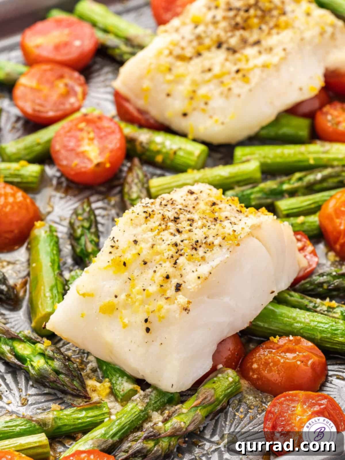One Pan Wonder Baked Cod 2 baked cod over roasted tomatoes and asparagus on sheet pan