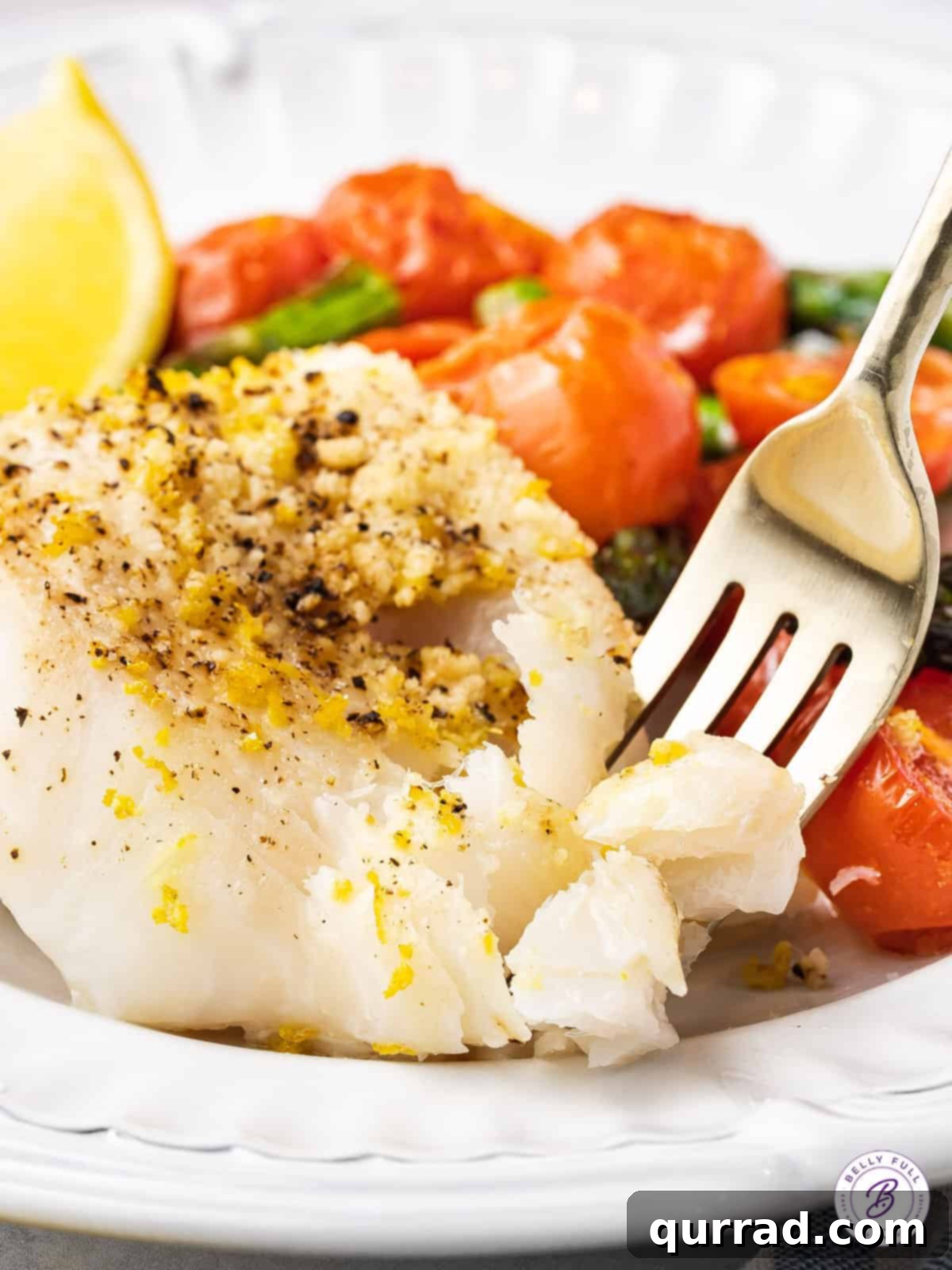 One Pan Wonder Baked Cod 4 fork separating flakey baked white fish