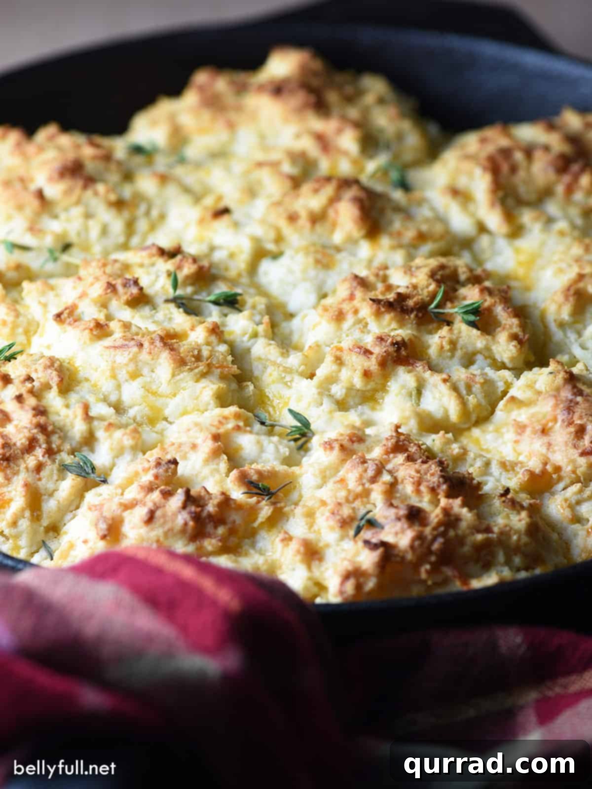 Sweet & Savory Apple-Cheddar Skillet Biscuits 4 A batch of drop biscuits in a cast iron skillet, golden brown and perfectly baked.