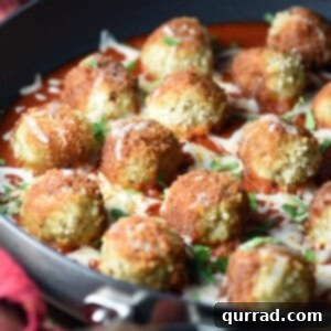 Chicken Parmesan Meatballs in pan with tomato sauce
