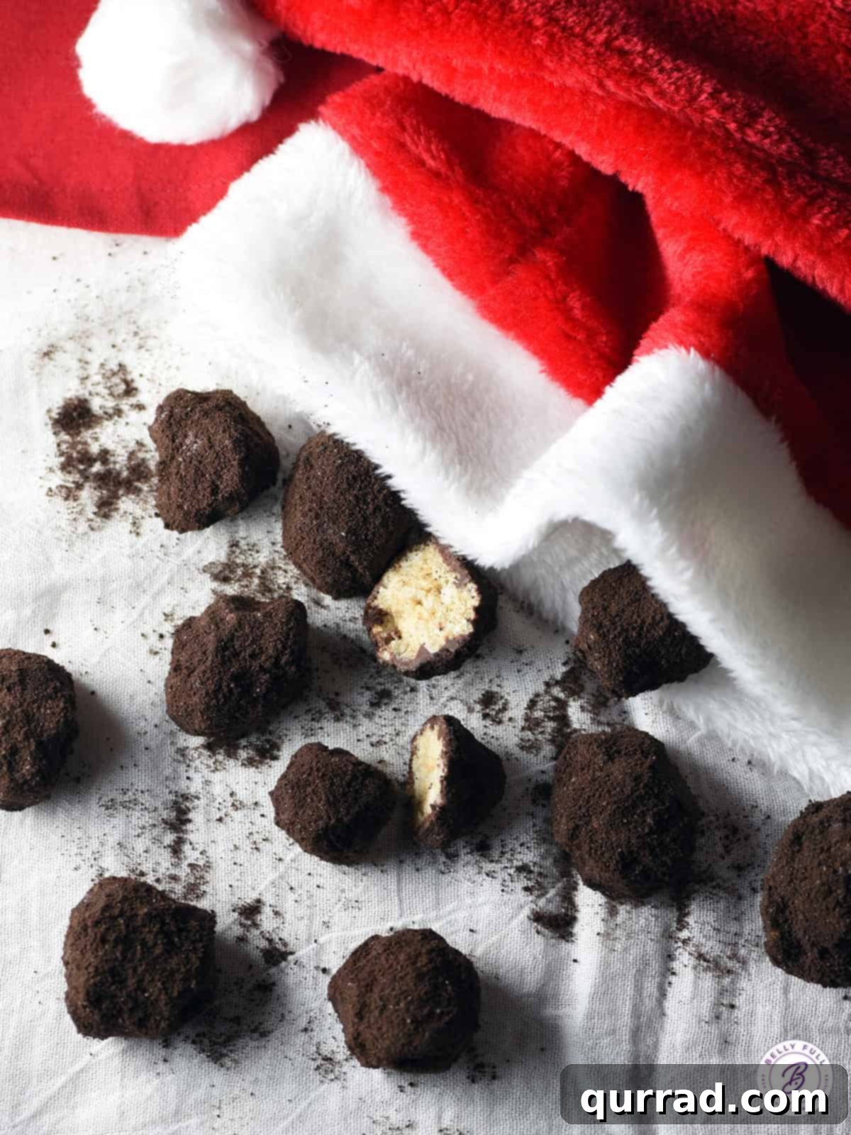 Black Diamond Krispie Treats 3 Lumps of Coal Rice Krispie Treats playfully spilling out of a festive Santa hat
