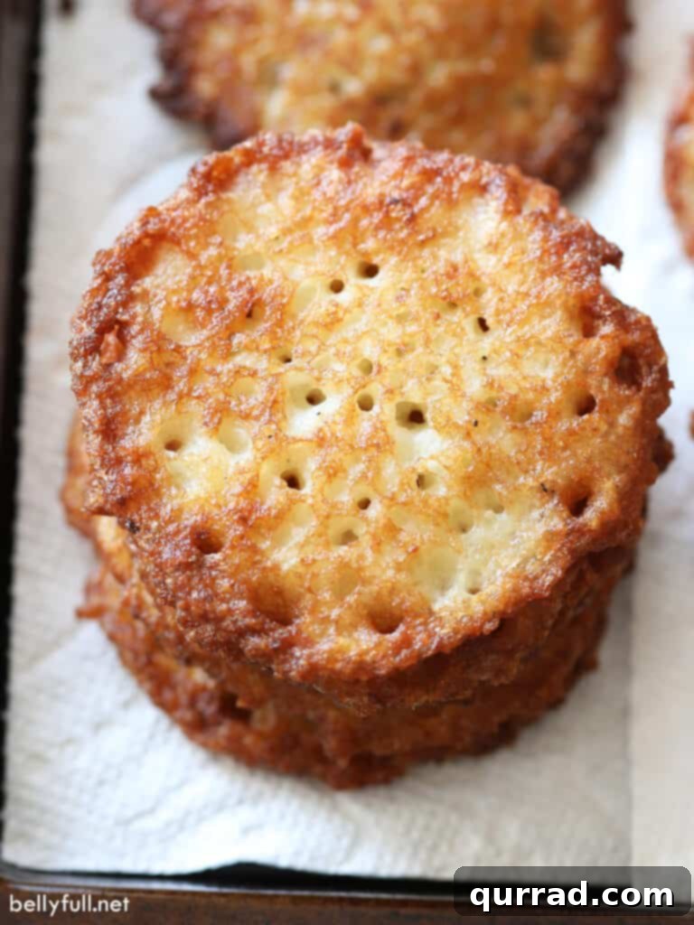 Crispy Potato Pancakes 10 A charming stack of golden fried potato pancakes, ready for serving.