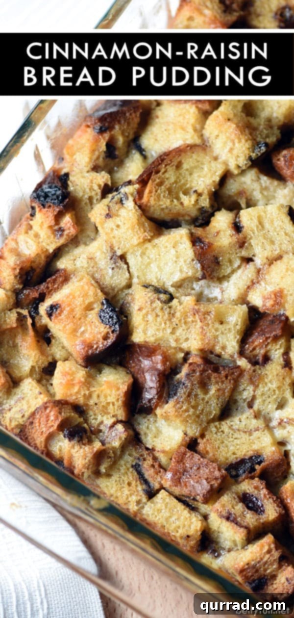 Close-up detailed picture of a baked cinnamon-raisin bread pudding slice, showcasing the moist interior, raisins, and cinnamon swirl, ready to be enjoyed.