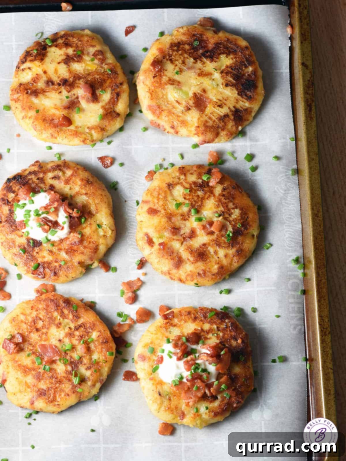 overhead sheet tray of fried potato patties