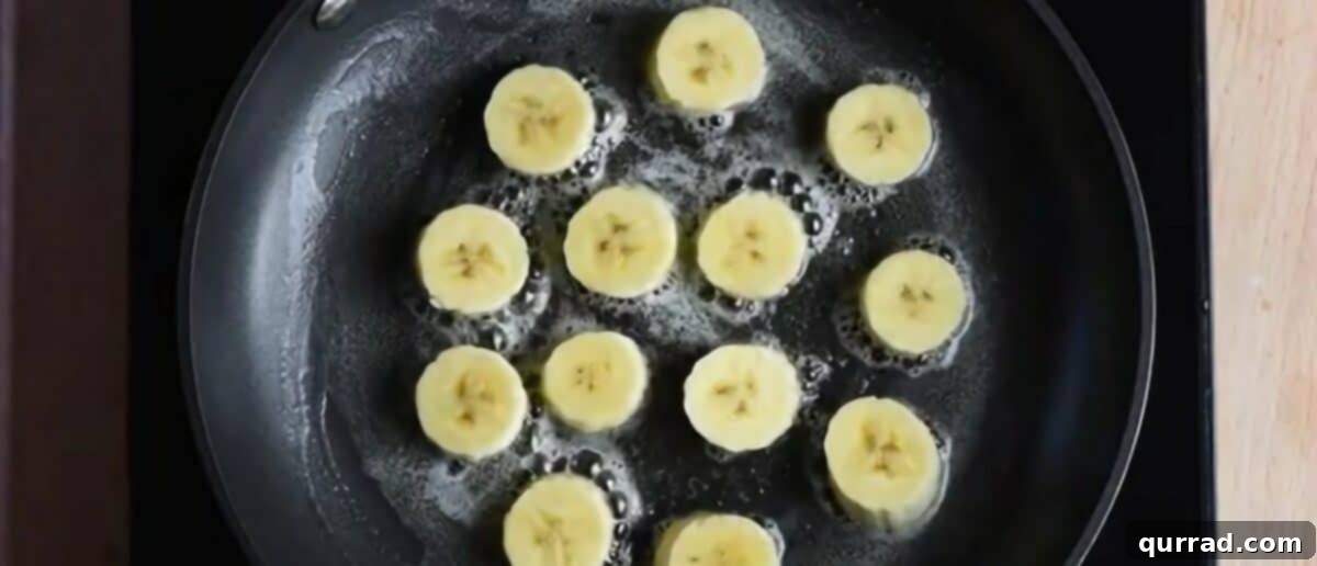 Golden Caramelized Bananas 3 Frying banana chunks in melted butter in a non-stick pan.