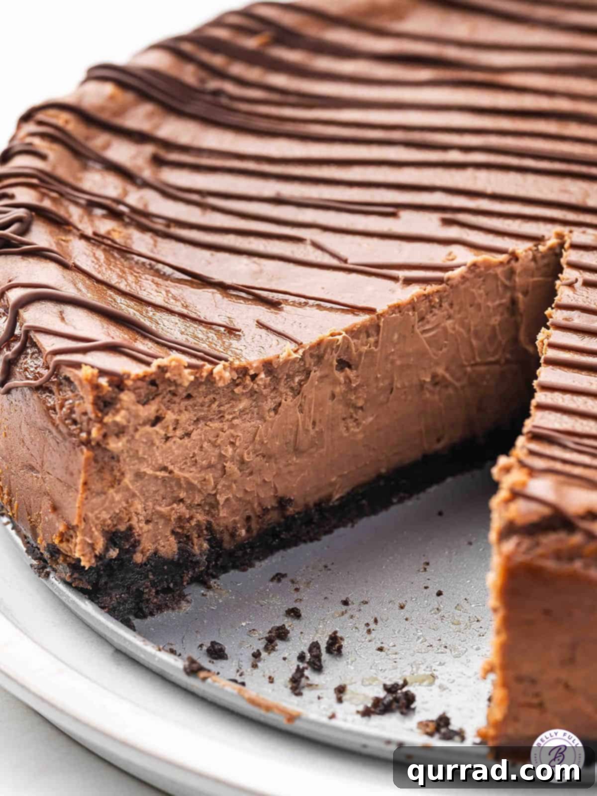 chocolate cheesecake on plate with slice missing