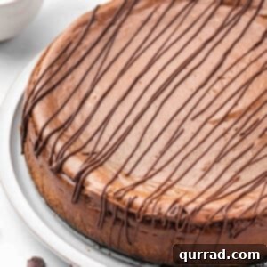 uncut chocolate mocha cheesecake with chocolate drizzle