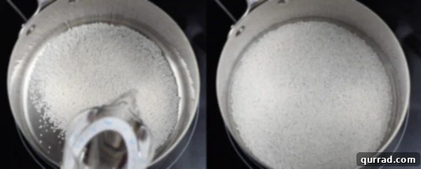 Water being poured over tapioca pearls in a pot, beginning the soaking process.