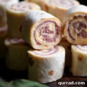 stacked Reuben Pinwheels appetizer on serving board