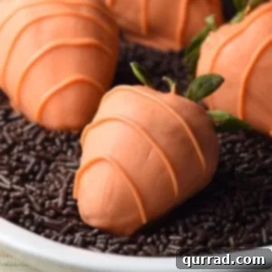 Close-up of a beautifully coated strawberry carrot, ready for serving.