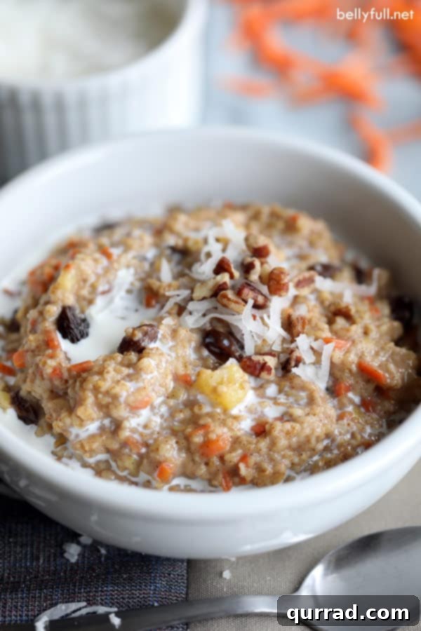 Delicious bowl of Carrot Cake Steel Cut Oatmeal topped with coconut and pecans, ready for a healthy breakfast
