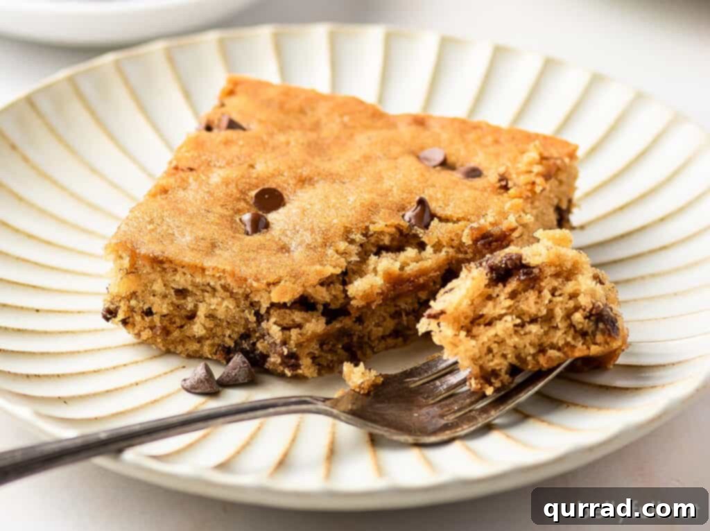 One-Pan Banana Dream 5 square piece of cake with bite take on fork