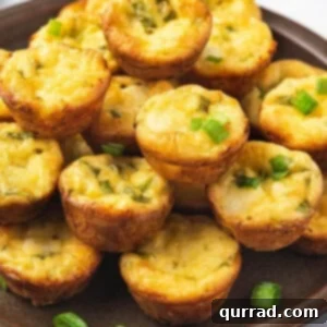 Crustless crab quiche bites piled on plate