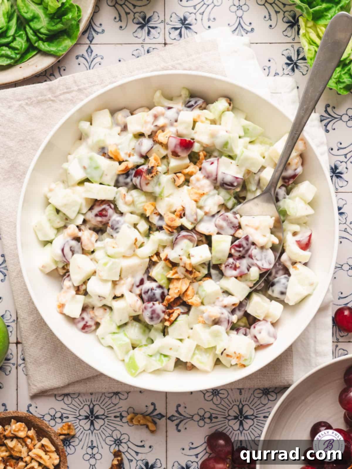 Crisp Apple & Walnut Waldorf Salad 2 overhead creamy Waldorf salad in serving bowl with spoon