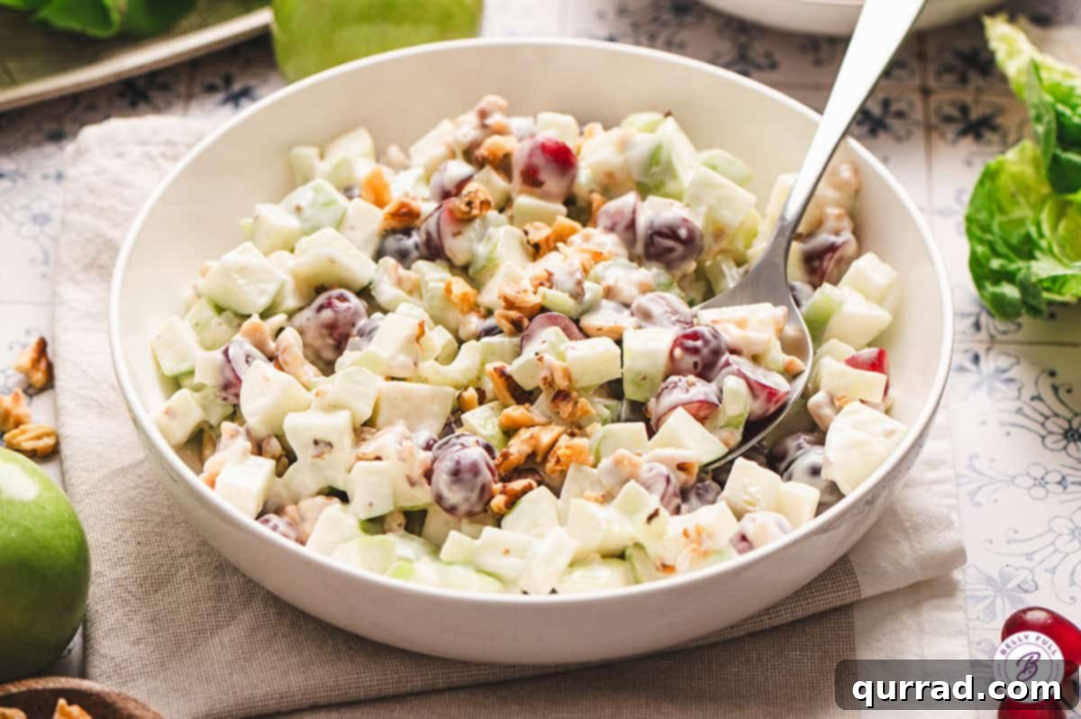 Crisp Apple & Walnut Waldorf Salad 8 creamy Waldorf salad in serving bowl with spoon