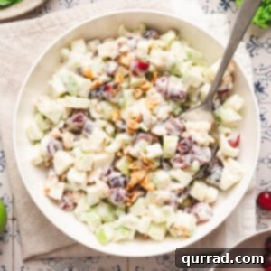 overhead creamy Waldorf salad in serving bowl with spoon