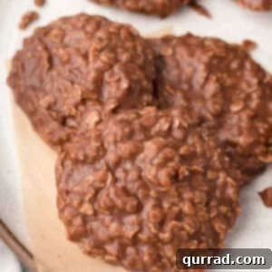 Close-up of freshly made chocolate no bake cookies on parchment paper, showcasing their textured surface