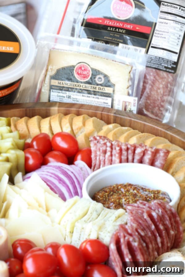 A feast for the eyes and palate: the ultimate Mini Deli Sandwich Charcuterie Board #CharcuterieBoard #GourmetSandwich #Foodie Close-up of a Mini Deli Sandwich Charcuterie Board with diverse selections