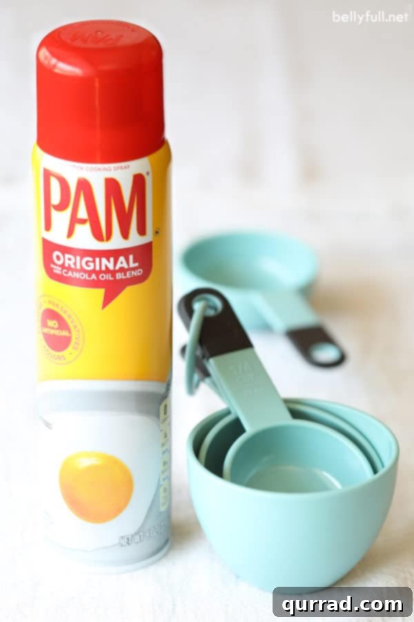 Smart Kitchen Secrets 3 Coat measuring cups with nonstick spray for easy release of sticky ingredients like honey or syrup.