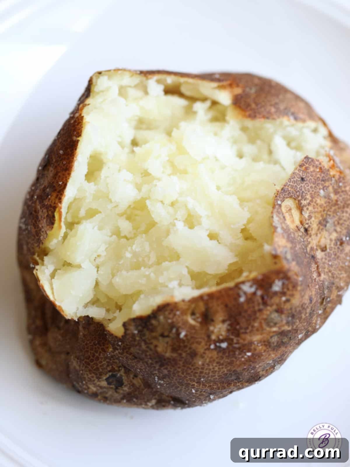 Fluffy Crispy Oven Baked Potatoes 4 split oven baked potato with fluffy middle