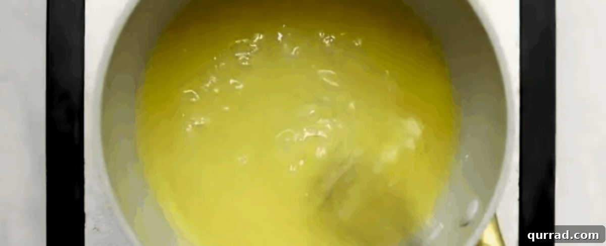 Vibrant Fruit Pizza 9 Whisking sugar, cornstarch, orange juice, and water in a small saucepan to make a clear glaze.