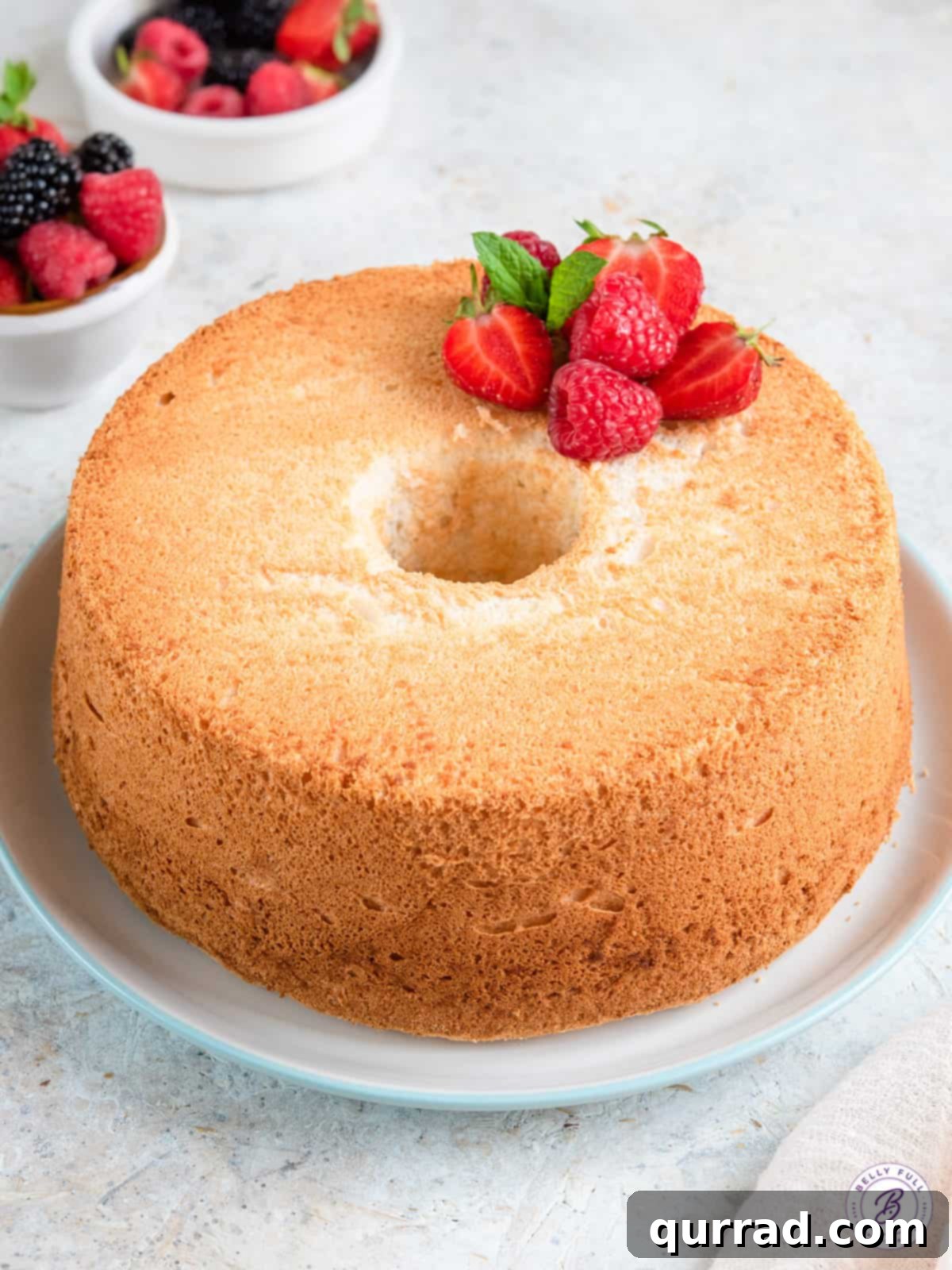 Whisper-Light Angelic Dessert 4 uncut angel food cake topped with berries