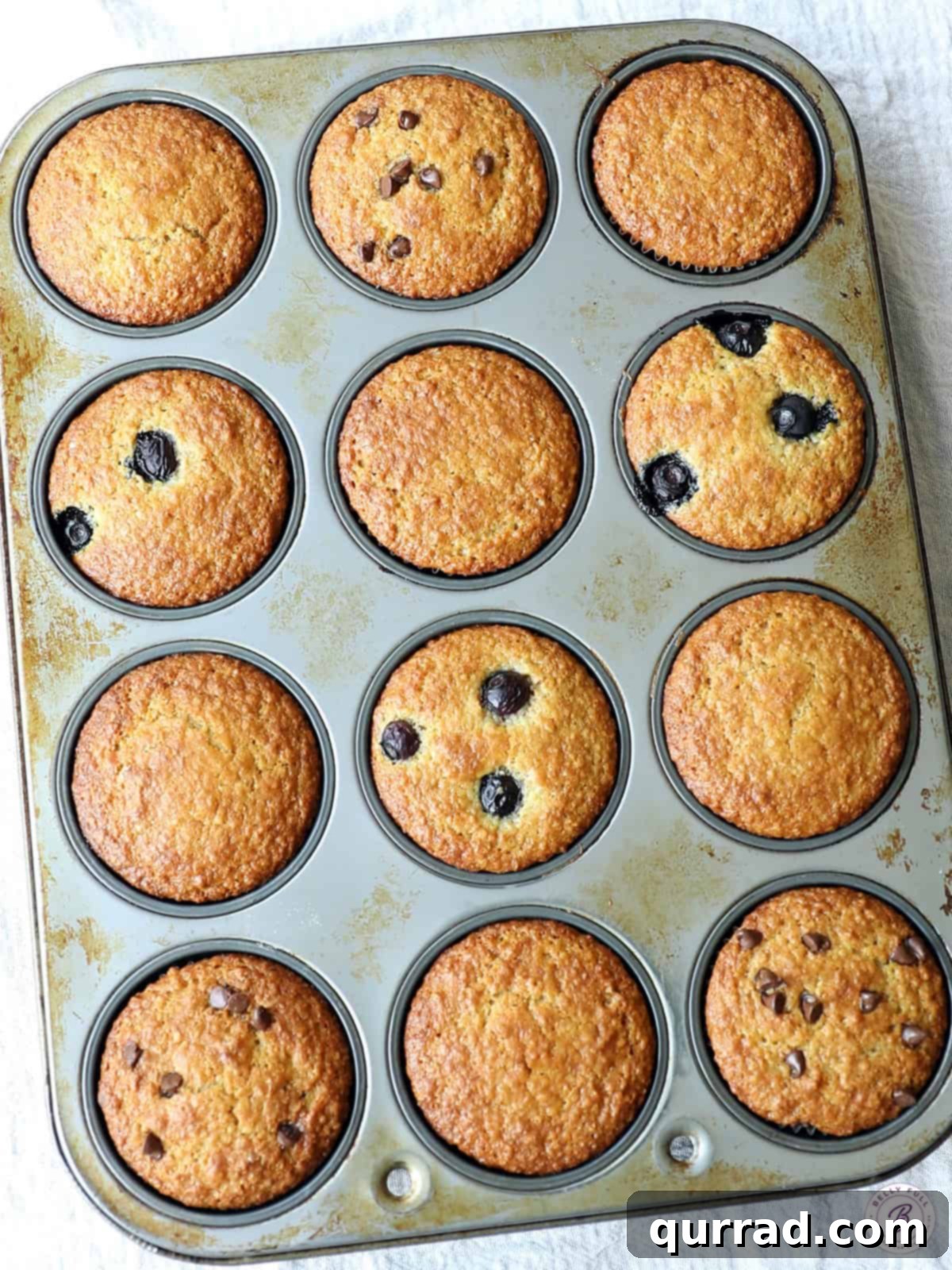 Freshly baked bran muffins in a muffin tin, ready to be enjoyed for a healthy breakfast or snack.