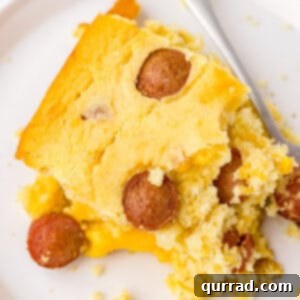 square piece of corn dog casserole on white plate