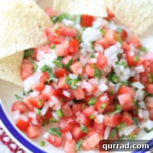 Pico de Gallo in a bowl with tortilla chips