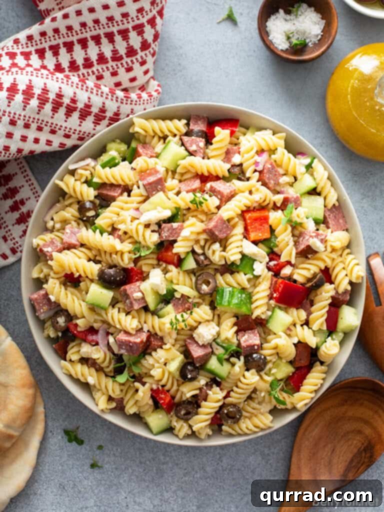 Aegean Pasta Salad 3 Close-up of Greek Pasta Salad with visible summer sausage, feta, and vegetables