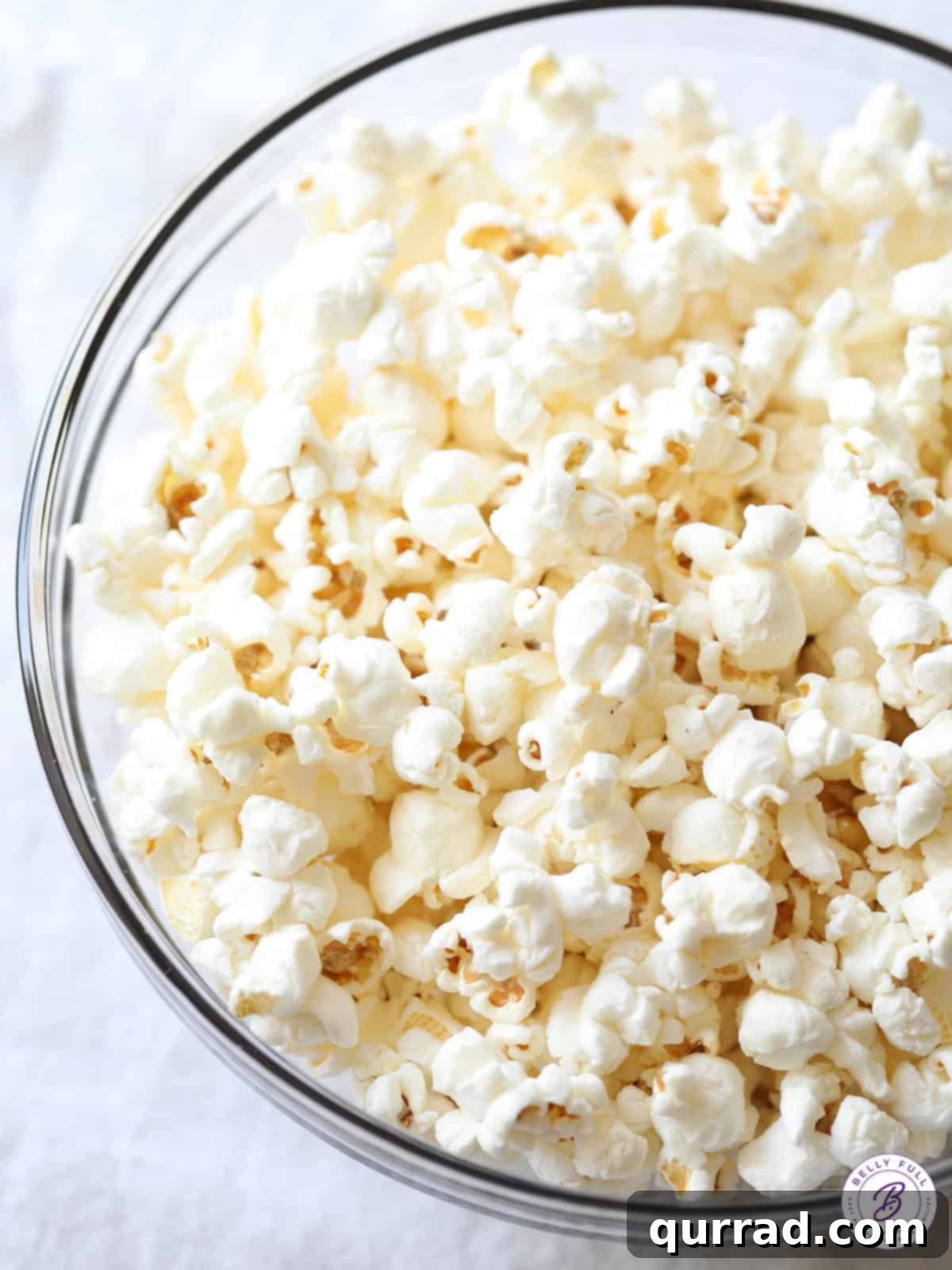 Movie Night Magic 5 A close-up shot of a large, rustic bowl filled with fresh, fluffy stovetop popcorn, ready to be enjoyed.
