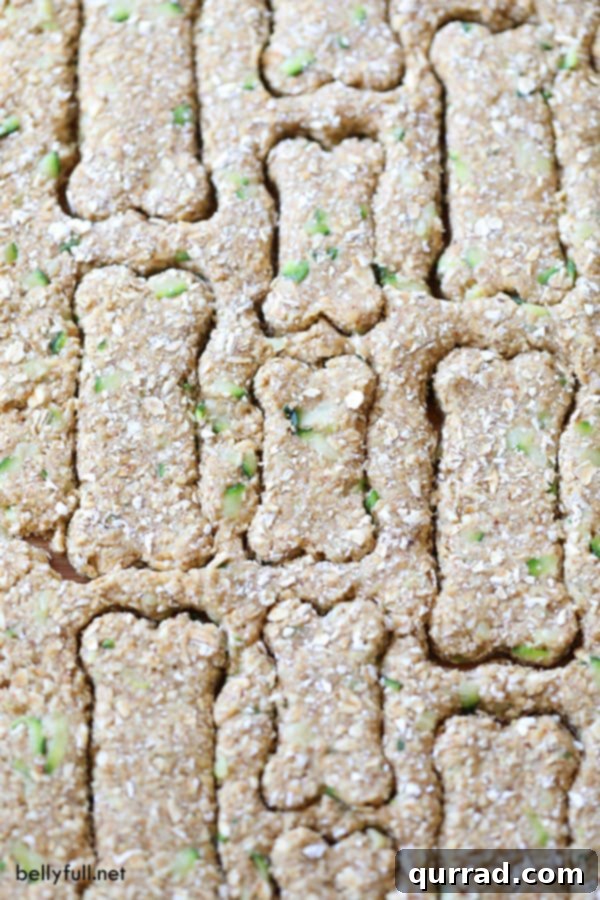 Homemade dog treat dough being prepared on a wooden surface