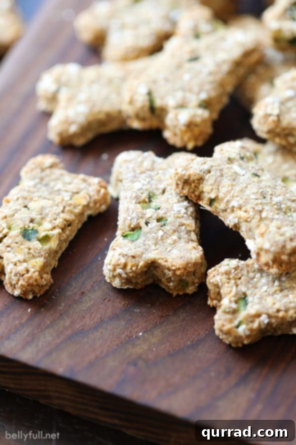Crunchy baked banana zucchini dog treats on a cutting board