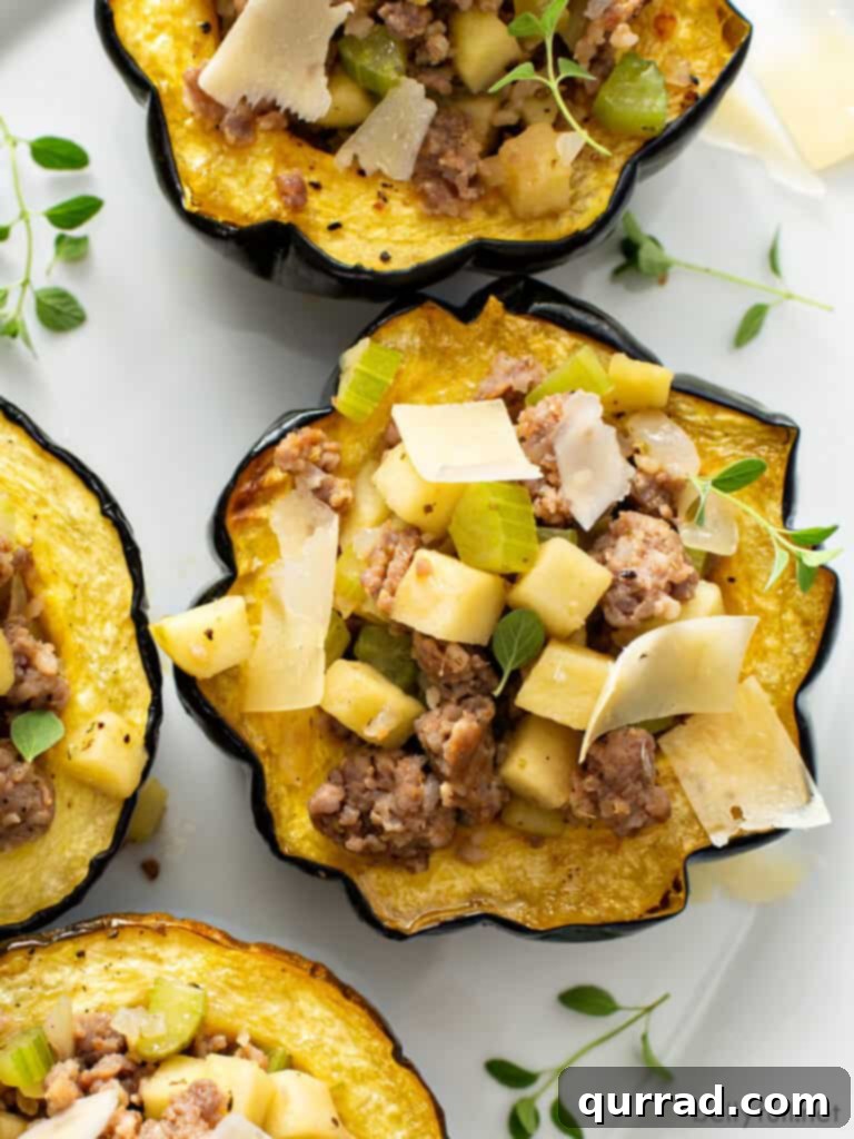 Autumn Sausage Stuffed Squash Boats 2 sausage and apple stuffed acorn squash with shaved Parmesan