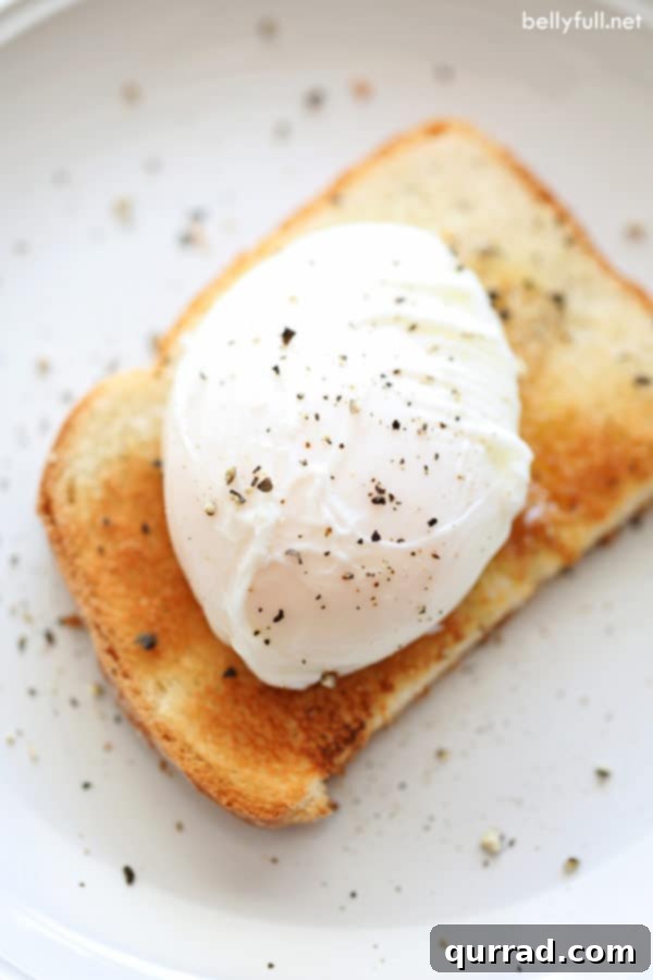 Perfectly poached egg on golden toast, ready for a delicious breakfast