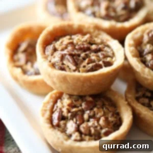 Mini pies stacked on serving tray, ready to be enjoyed.