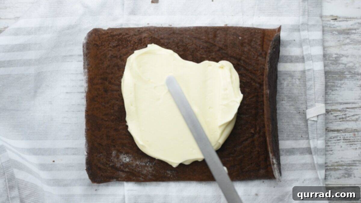Decadent Chocolate Log 12 Spreading the filling over the cake.