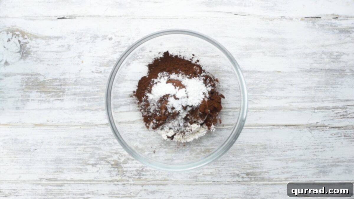 Decadent Chocolate Log 3 Combining the dry ingredients in a glass bowl.