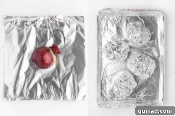 trimmed beets individually wrapped in aluminum foil, placed on a baking sheet