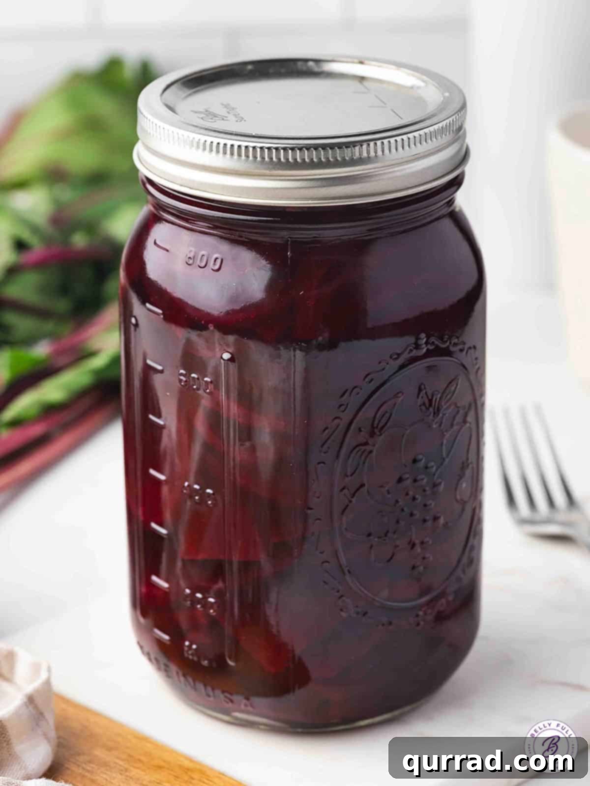 Zesty Brined Beetroot 11 Close-up of a tall glass jar filled with vibrant pickled beets, ready to be served or stored
