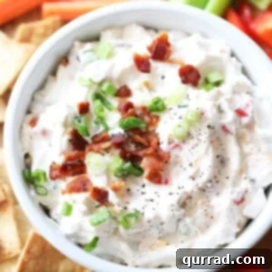 Close-up of BLT Dip with rich texture and colorful garnishes, ready to be served.