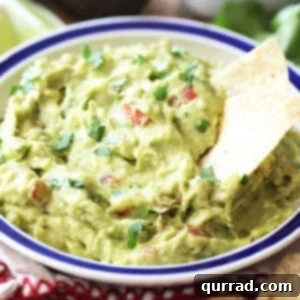 bowl of guacamole with tortilla chips