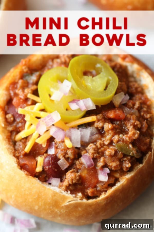Pinterest pin image featuring mini bread bowl chili with toppings, enticing readers to save the recipe.
