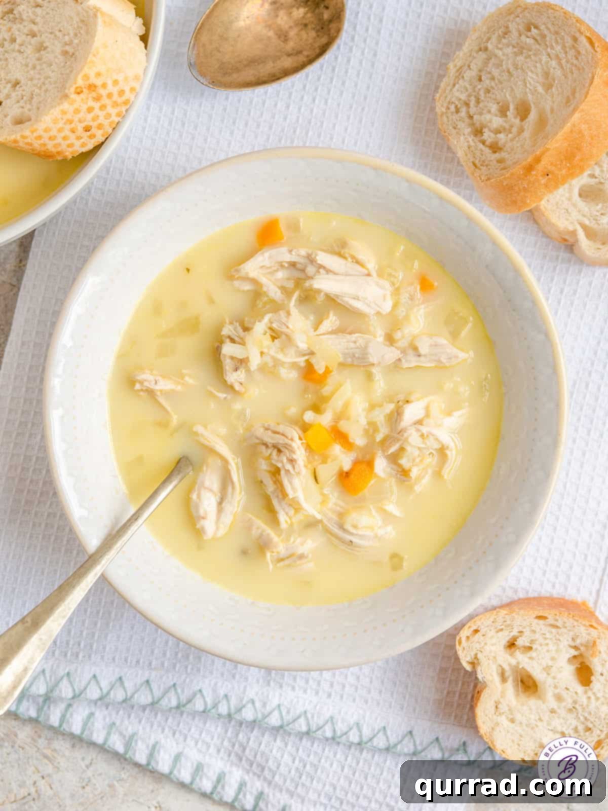 Golden Avgolemono Greek Lemon Chicken Soup 2 Bowl of Greek Lemon Chicken Soup, garnished with fresh dill.