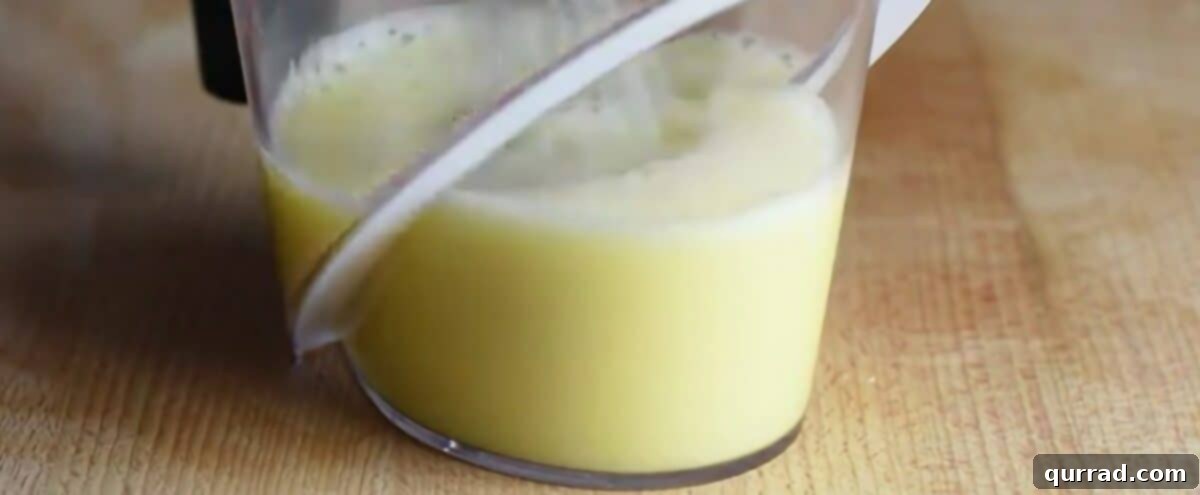 Golden Avgolemono Greek Lemon Chicken Soup 7 Whisking fresh lemon juice and eggs together in a bowl until light and frothy.