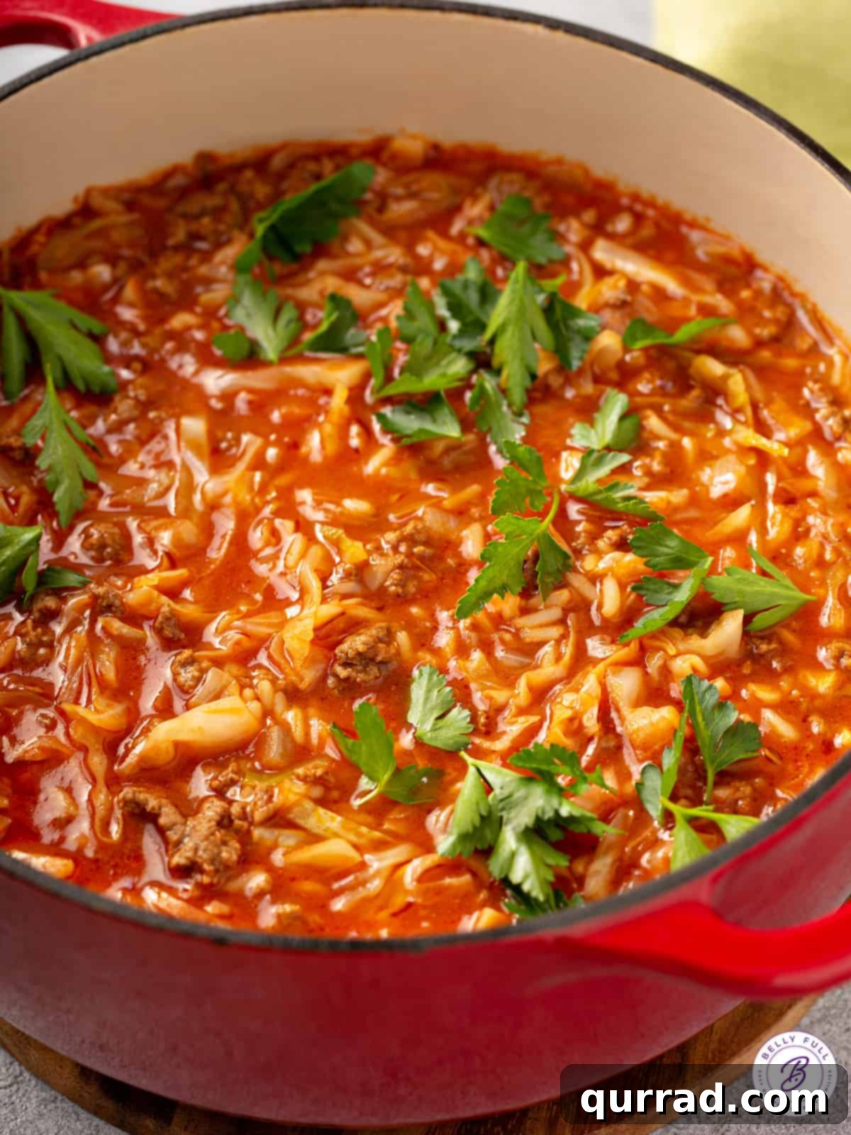 Deconstructed Cabbage Rolls 2 A vibrant pot of unstuffed cabbage roll soup filled with tender cabbage, seasoned ground beef, and rice in a rich tomato broth, ready to be served for a hearty meal.