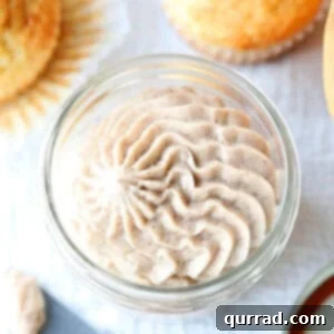 overhead picture of cinnamon honey butter piped into glass jar