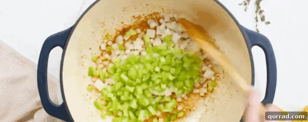 Creamy Golden Corn Chowder 6 Sautéing finely diced onion and celery in the pot with butter and bacon grease.
