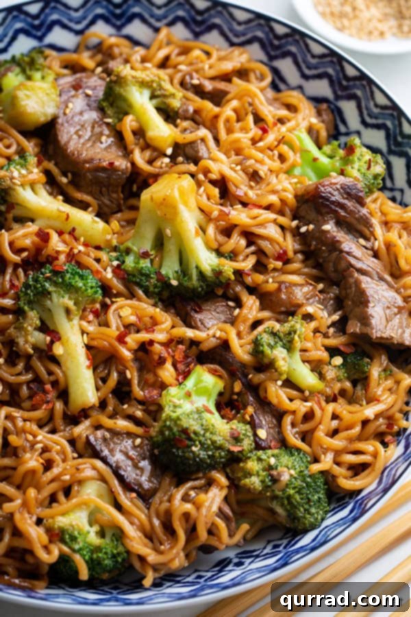 Homemade beef and broccoli ramen noodle stir fry served in an ornate bowl, ready to be enjoyed.