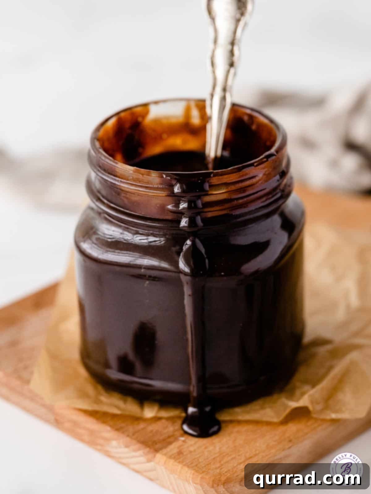 Rich Homemade Chocolate Sauce 2 Rich homemade chocolate sauce poured into a glass jar, ready for delicious desserts